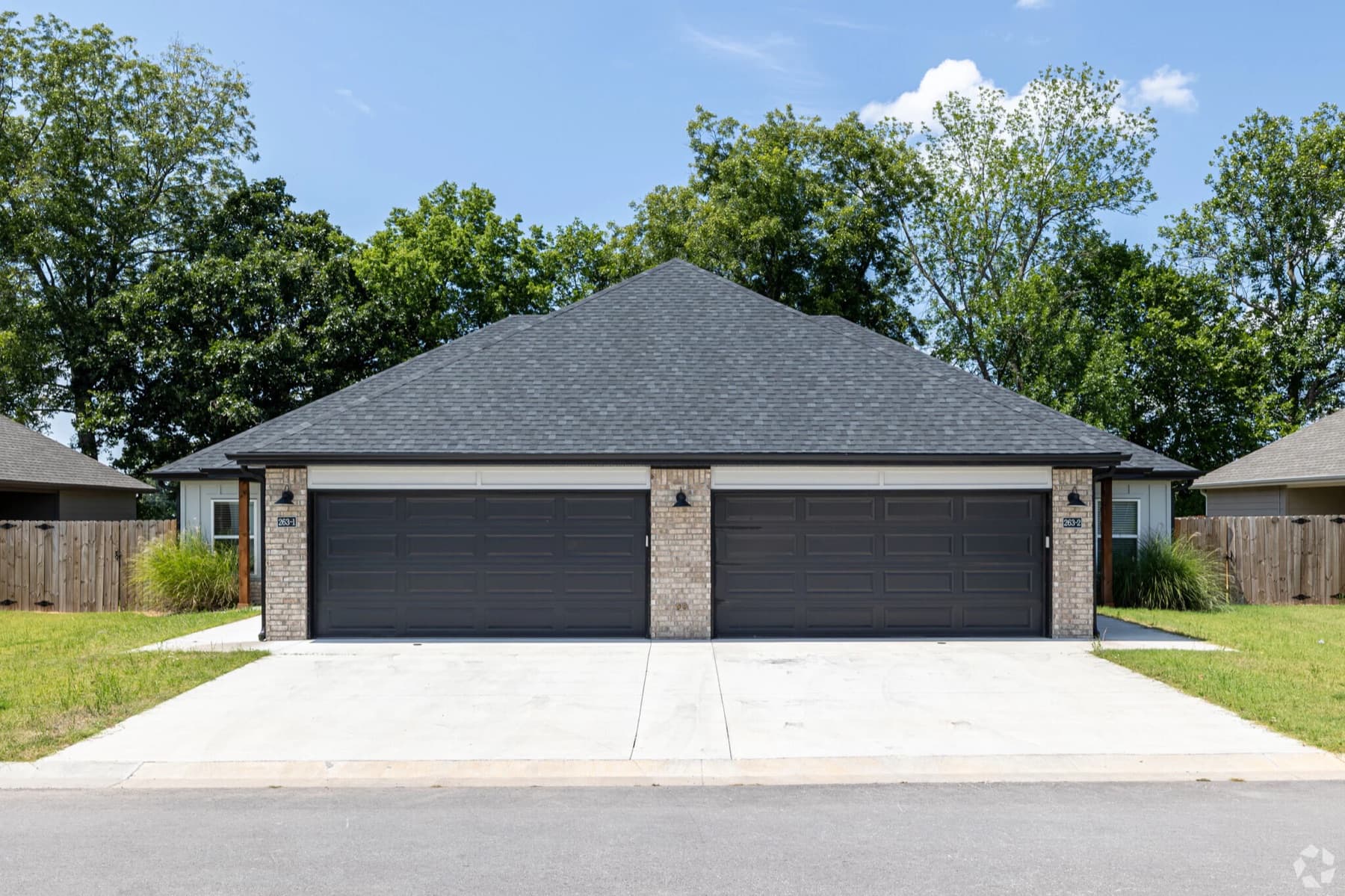 The front of a brick duplex home in Farmington, Arkansas, one of the homes Halo Homes operates